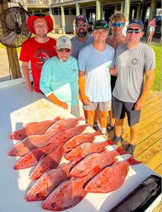 Red snapper fishing catch displayed on cleaning table in Gulf Shores AL