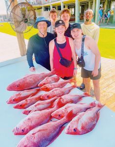 Red snapper fishing catch displayed on dock in Gulf Shores AL