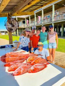 Red snapper fishing catch displayed on cleaning table at Gulf Shores AL marina