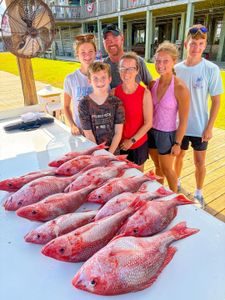 Fresh caught red snapper displayed on cleaning table at Gulf Shores Alabama fishing charter