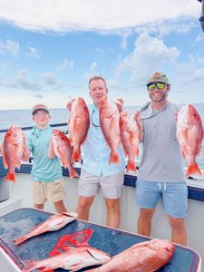 Red snapper fishing charter catch displayed on boat in Gulf Shores AL