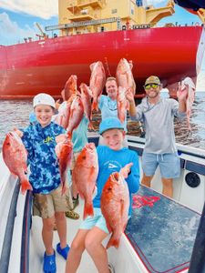 Successful red snapper fishing trip in Gulf Shores AL with multiple large fish caught