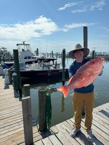 A person fishing in Gulf Shores