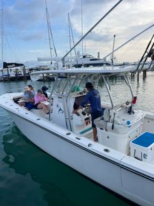Three anglers with fishing rods standing in Key West, Florida