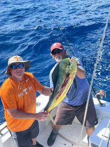 Two people fishing on the coast of FL