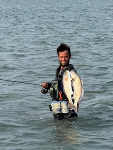 A person fishing in Aransas Pass