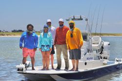 Group of 5 people fishing in Aransas Pass