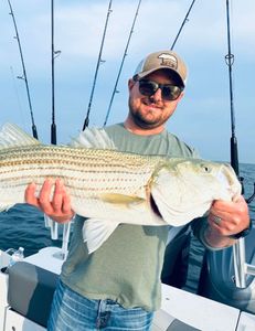 One fisherman at Bourne with a big fish