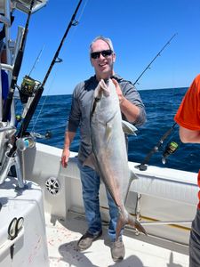 A person fishing in SC with a big fish