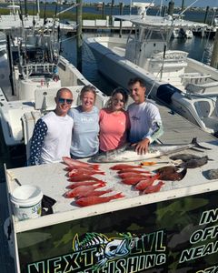 Group of 6 people fishing in unknown location