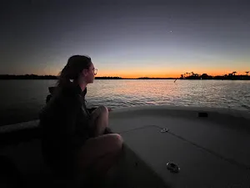 A person fishing in FL on a cruises and tours fishing trip.