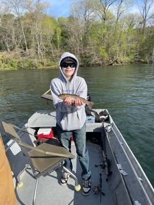 Angler with a rainbow trout in AR