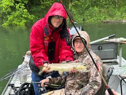 Angler with rainbow trout in Cotter