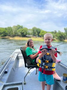 Two people enjoying a fishing trip in Cotter