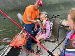 Angler with a rainbow trout in AR