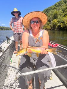 Anglers catching a big fish in AR