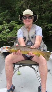 A fisherman with a large sea trout catch in Cotter