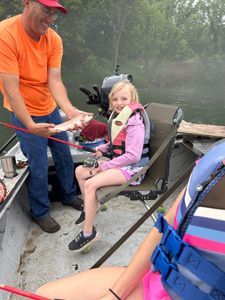 Angler holding a rainbow trout in Cotter
