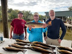 3 people fishing with fishing rods in LA