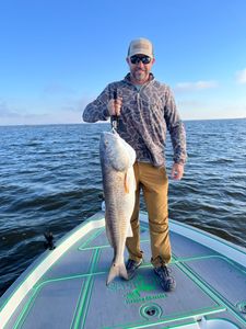 A lone fisherman in St Bernard catching a 29-inch fish during a fishing trip
