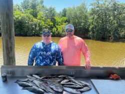 Two people fishing in St Bernard