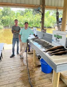 Two people fishing in St Bernard