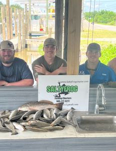 Three people enjoying fishing trip at St Bernard location