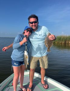 Two summer flounder and redfish caught on a fishing trip in LA
