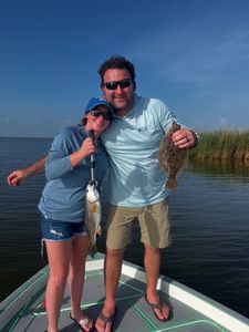 A fishing trip with 2 Southern Flounder and Redfish caught in LA