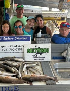 Four large redfish caught on a fishing trip in LA