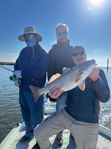 Angler catching a redfish in LA