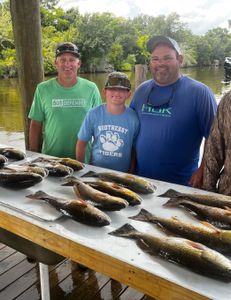 Three anglers caught Atlantic Croaker and Redfish in LA.