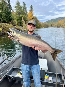 Angler catching a 33-inch rainbow trout in OR