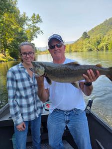 Two people enjoying a fishing tour in OR
