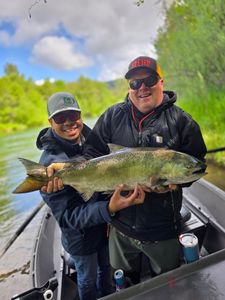 Two people enjoying a fishing tour in OR