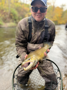 Exciting catch with fly fishing technique! Adventure awaits on the water.
