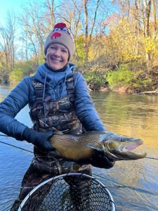 Angler with fishing rod enjoying the views at Waterport