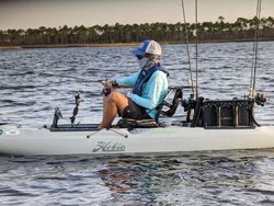 Steady angler on a loaded kayak