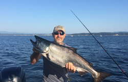 Angler holding a sea trout in BC
