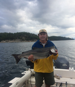 Angler with a large 26-inch fish caught in Zeballos