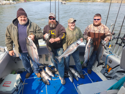 four anglers fishing in manistee with four 14-inch fish