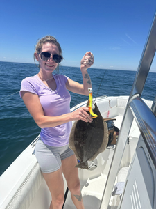 Angler catching a fish in the waters of Cape May