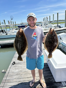 Two California Flounder and Summer Flounder caught while fishing in Cape May
