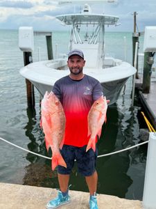 Angler fishing in Florida with two fish