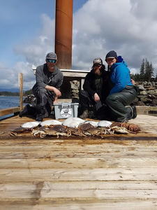 Three people fishing at the beautiful location of Port Renfrew