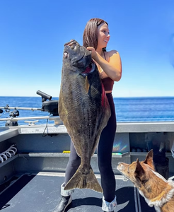 Fisherman with 2 fish in Port Renfrew