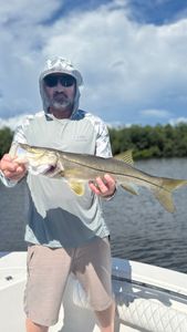 A person fishing for a snook in FL