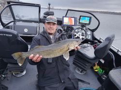 A lone fisherman reeling in a 28-inch catch in Minnesota