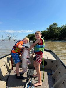 Angler with a blue catfish in AR