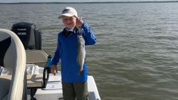Successful angler with 14-inch fish, fishing in TX
